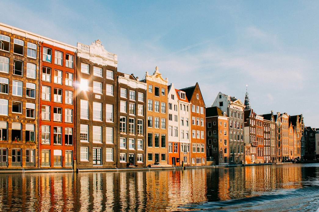 Canals and historic Dutch Baroque houses by the water in Amsterdam