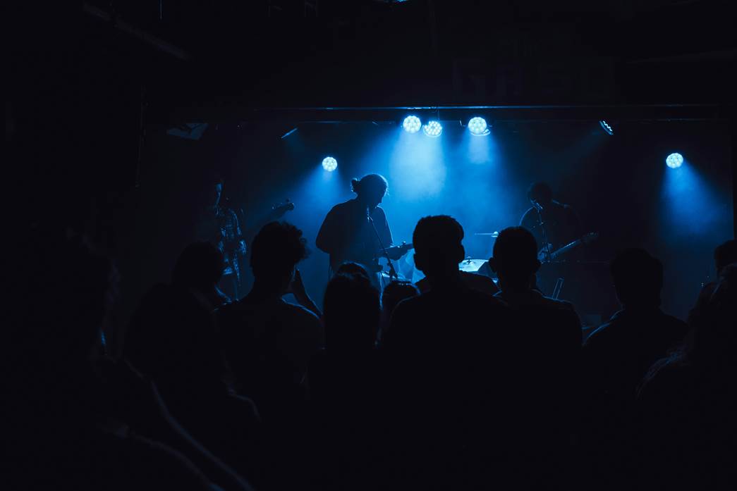 A silhouette of a concert.