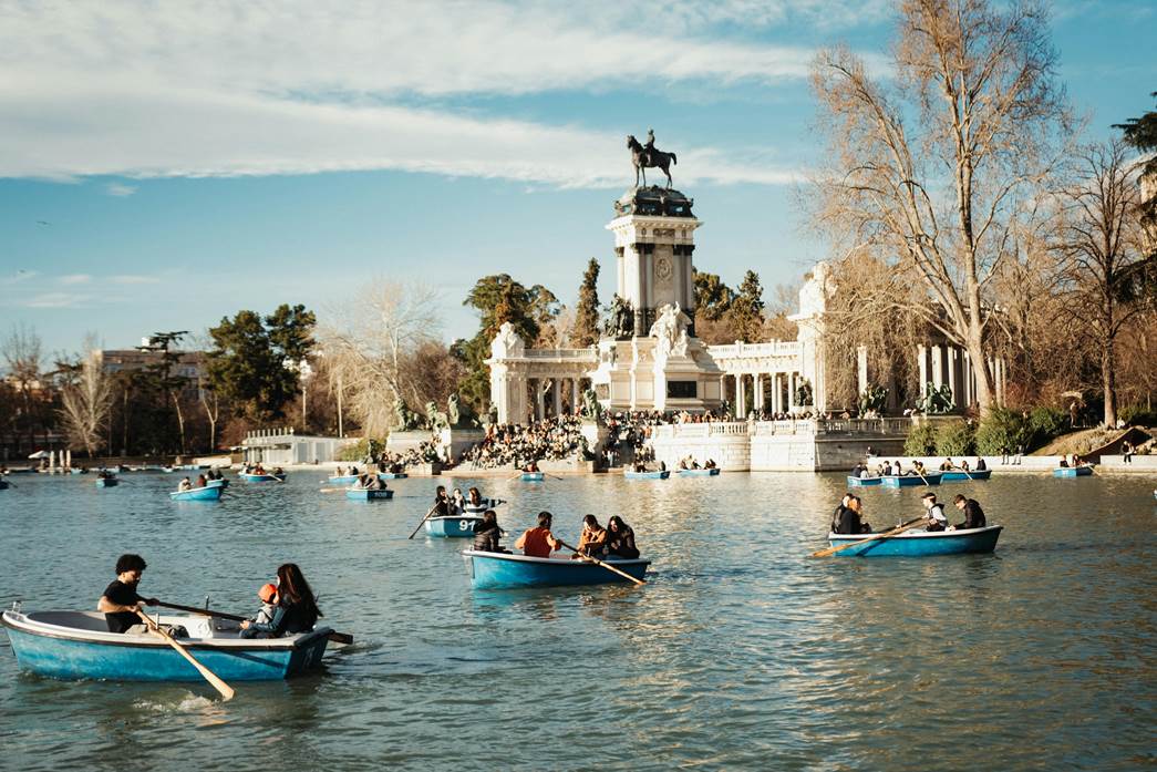Various people on numerous rowboats.