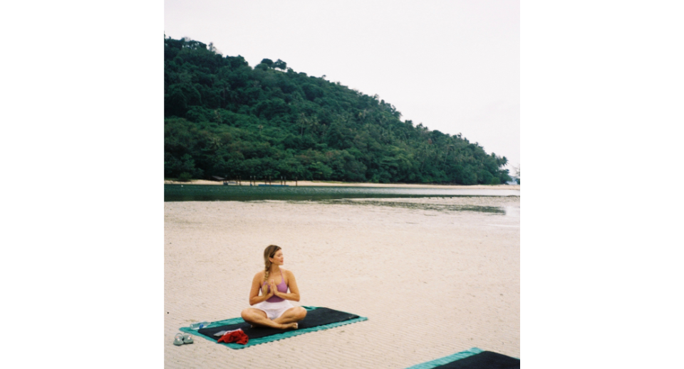 Morning yoga by the bay in front of the villa at Avani+ Samui Resort